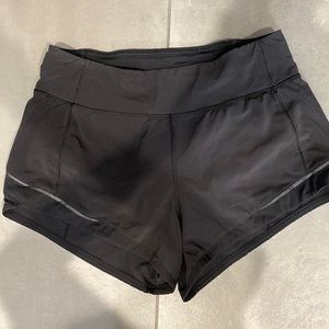 Black lined Lululemon Shorts (2.5 in inseam). Size four